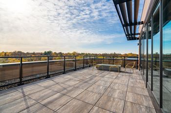 Outdoor rooftop lounge with firepit